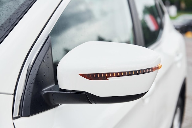 Front particle view of white modern automobile Side mirror