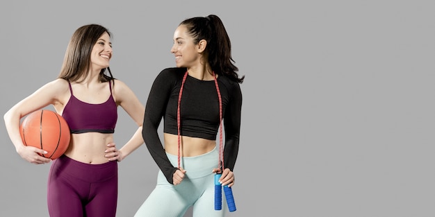 front view of beautiful sporty women with copy space