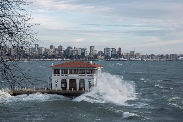 front view, big waves hitting the shore on a stormy day. Moda iskelesi