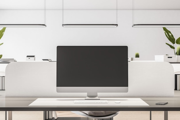 白いインテリア デザイン 3 D レンダリング モックアップとミニマルなスタイルのオフィスのワークスペース テーブルにロゴやテキストの場所と空白の黒いモニター画面の正面図