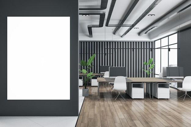 Front view on blank white poster with place for your logo or text on black wall in spacious stylish coworking office with wooden floor cozy workspaces and green plants 3D rendering mockup