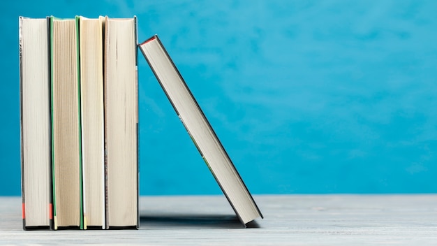 Photo front view books with blue background