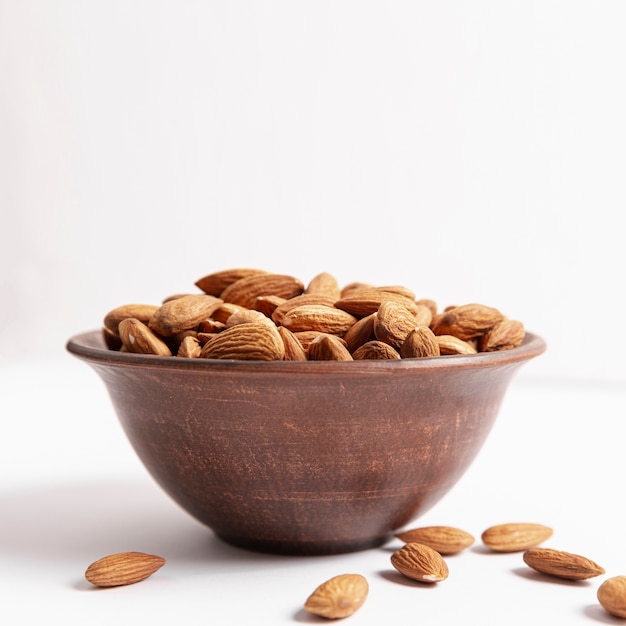 Front view of bowl with almonds and copy space