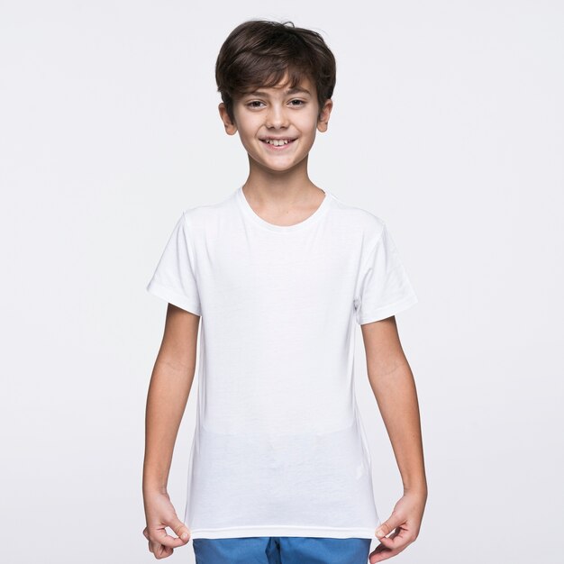 Front view boy pulling shirt