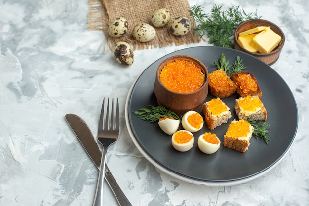 front view caviar sandwiches with boiled eggs inside plate white background dinner seafood breakfast fish food toast meal lunch bread