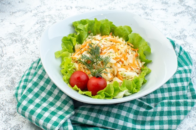 front view chicken salad with green salad inside plate on light surface