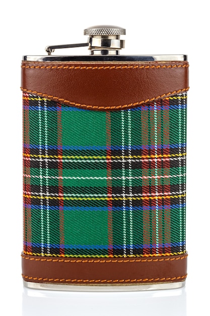 Front view of classical scotland pewter hip flask with leather and tartan trim isolated on white background