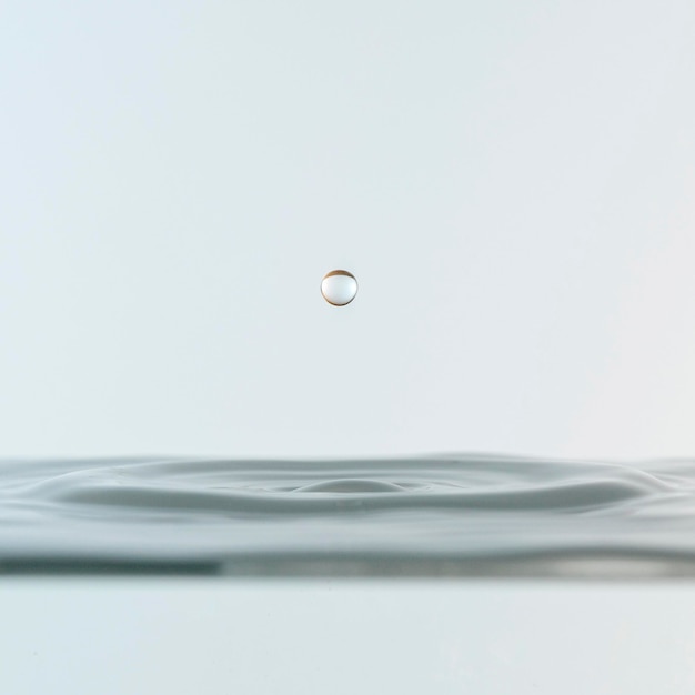 Photo front view of clear water drop with liquid