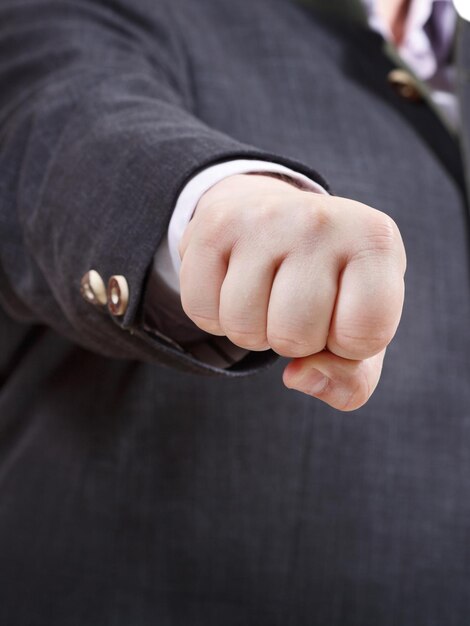 Photo front view of clenched fist of businessman