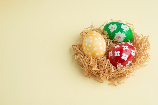 front view colored designed eggs on straw yellow background horizontal novruz spring colourful ornate holiday