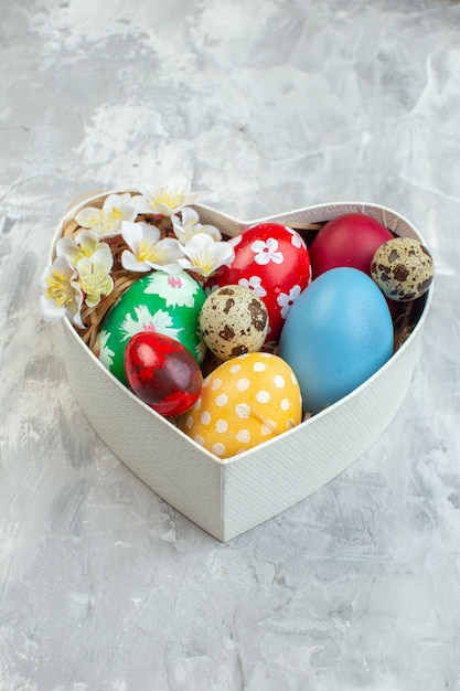 front view colored easter eggs inside heart shaped box on white background colourful ornate femininity concept novruz spring easter