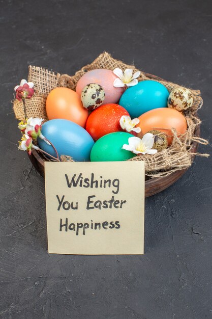 front view colored easter eggs inside plate on dark background holiday ornate colourful concept bird spring colour