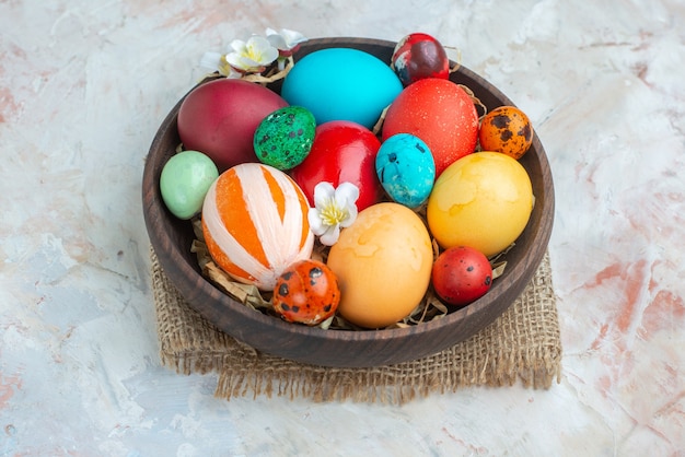 front view colored painted eggs inside plate on white background sugar colourful ornate novruz sweet spring holiday dessert