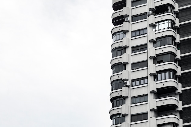 Front view of concrete building in the city with copy space