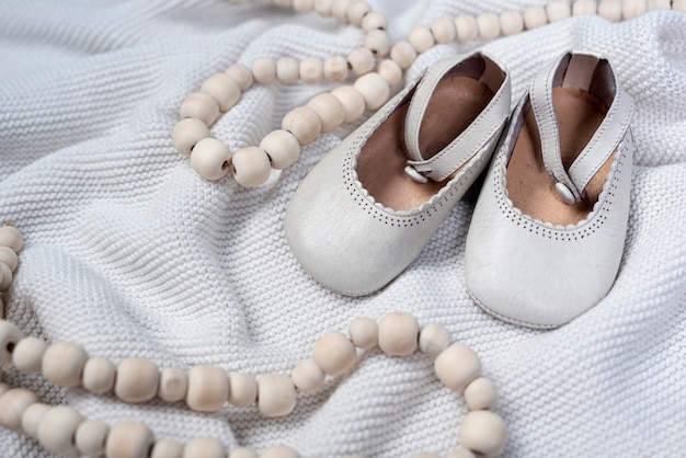 Front view of cute little girl shoes on blanket