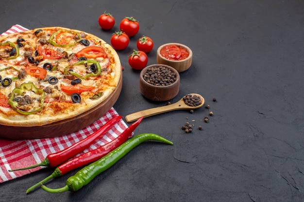 Front view delicious cheese pizza consists of olives pepper and tomatoes on dark surface