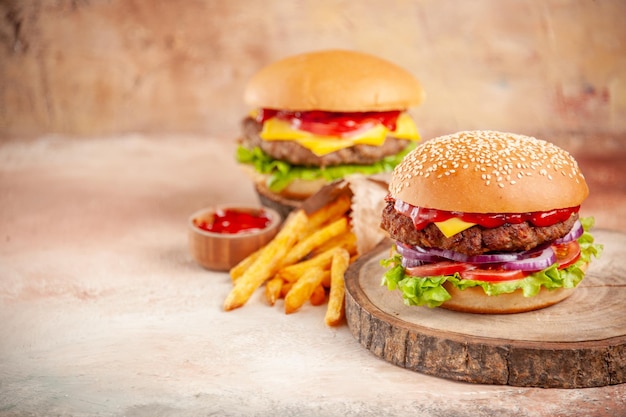 Front view delicious cheeseburger on cutting board light background salad fast-food sandwich dish snack dinner burgers