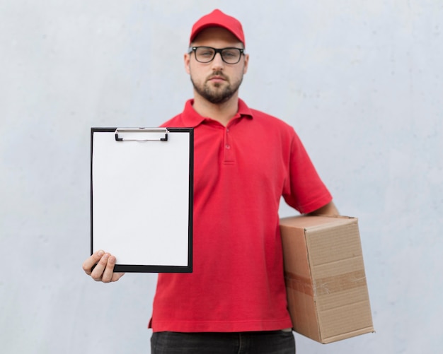 Front view of delivery man concept with copy space