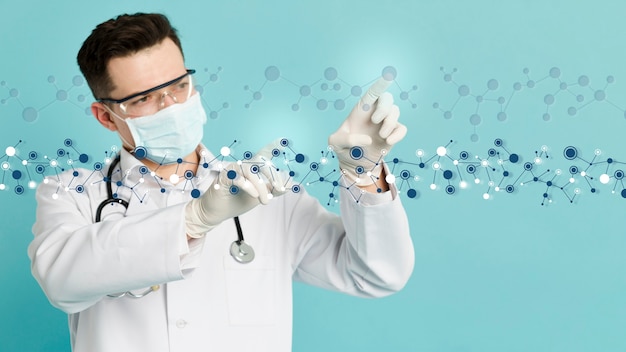 Front view of doctor with surgical gloves analyzing molecular structures