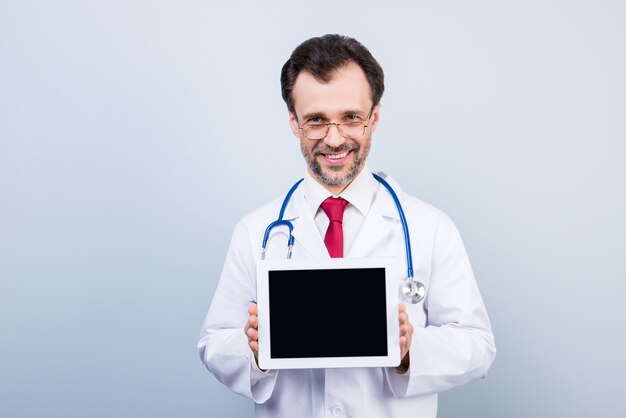 Front view of doctor with tablet and stethoscope
