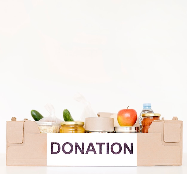 Front view of donation box with food and copy space