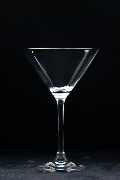 Front view empty cocktail glass on a dark background color wine alcohol celebration holiday restaurant