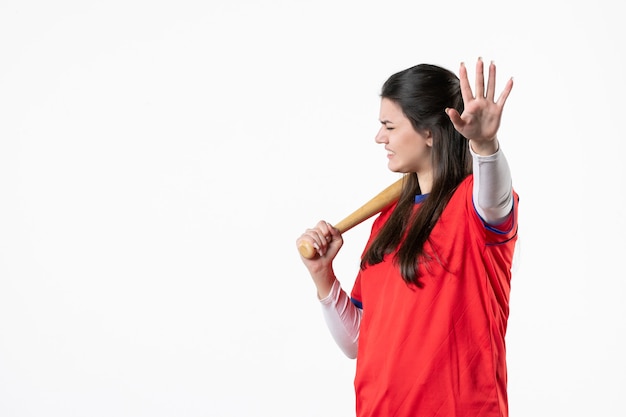 Front view female baseball player with bat and ball