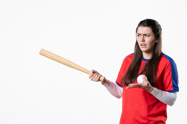 Front view female baseball player with bat and ball