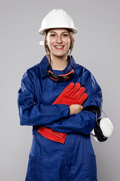 Front view of female construction worker posing