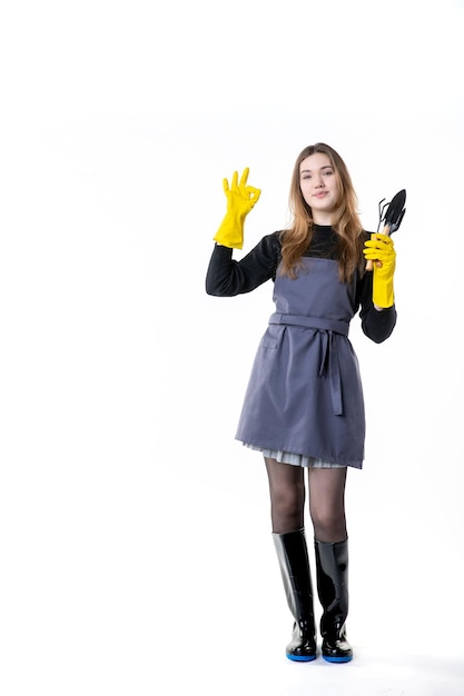 Front view female gardener in yellow gloves on white background color flower tree plant woman job work garden