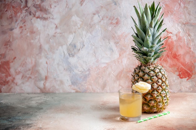 front view fresh pineapple dry pineapple rings on juice glass pipette on beige background with copy space