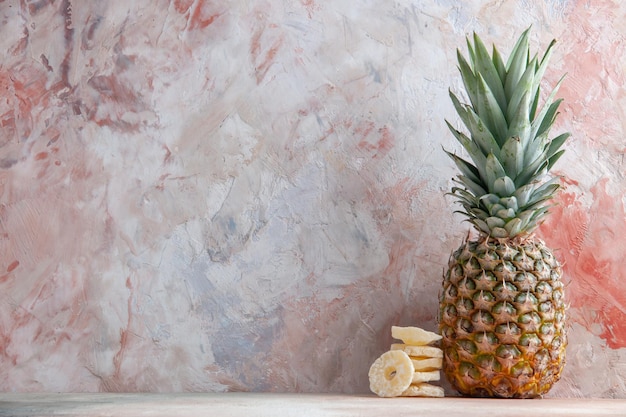 front view fresh pineapple fruit dry pineapple rings on table with copy place