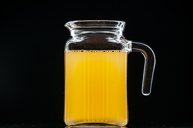 front view fresh pineapple juice in carafe on black background