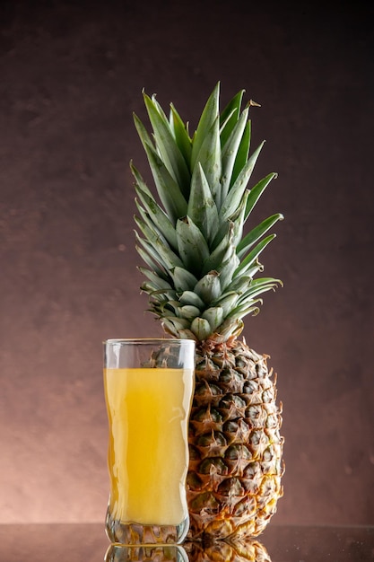 front view fresh pineapple juice pineapple fruit on brown background