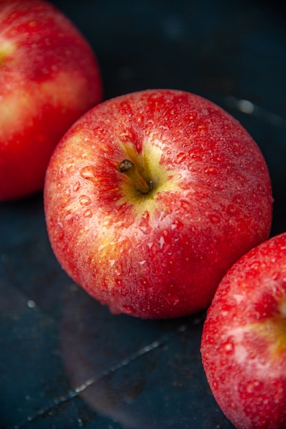 Front view fresh red apples on dark surface