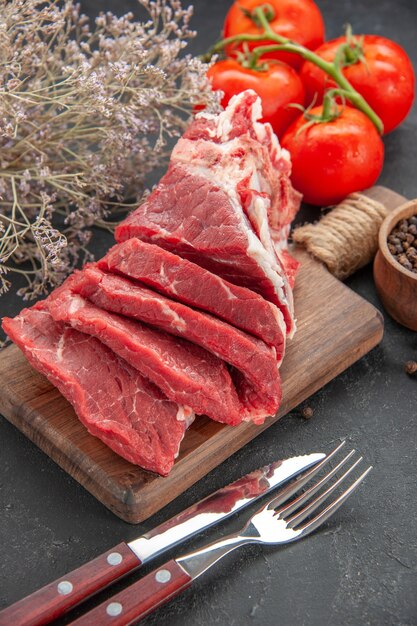 front view fresh sliced meat with pepper and tomatoes on dark background meat animal barbecue food color meal butcher dinner
