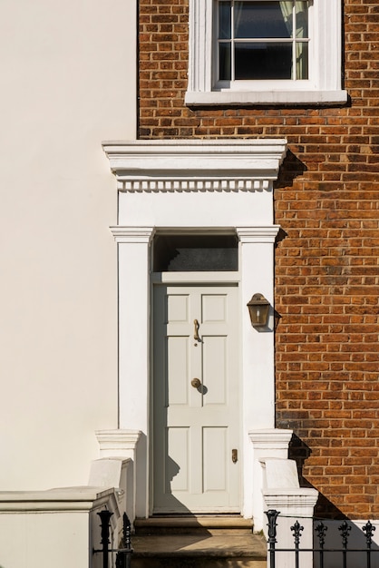 Front view of front door with beige and brown wall