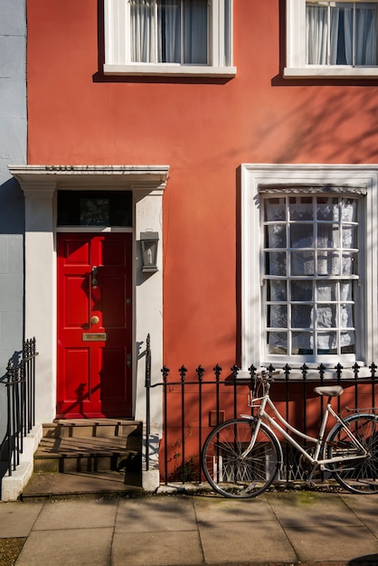 Front view of front door with orange wall