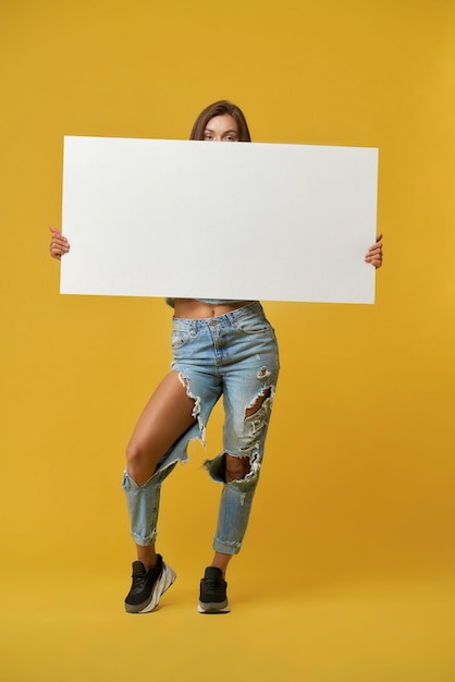 Front view of girl holding banner