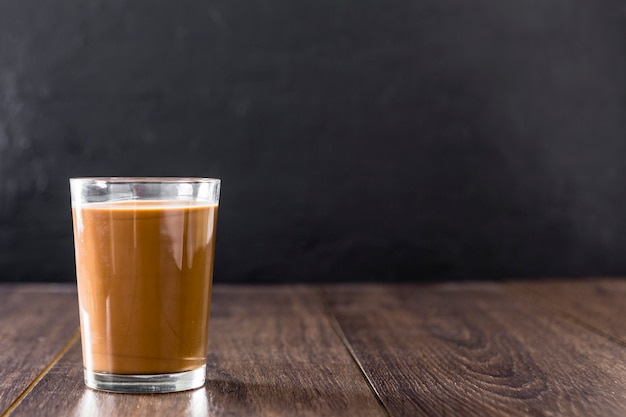 Front view of glass of chocolate milkshake