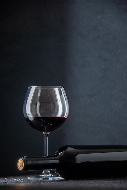 front view glass of wine with bottle of wine on dark background alcohol restaurant color love couple feeling darkness