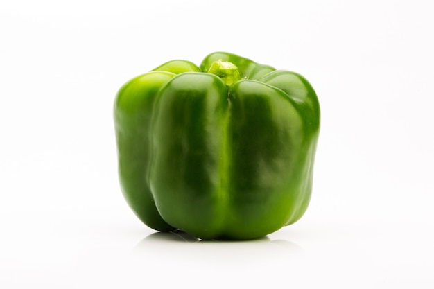 Front view of green pepper on a white background, vegetable to flavor