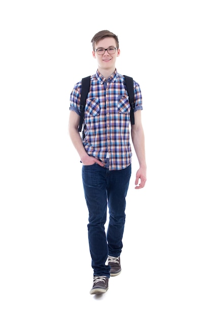 front view of handsome teenage boy with backpack walking isolated on white background