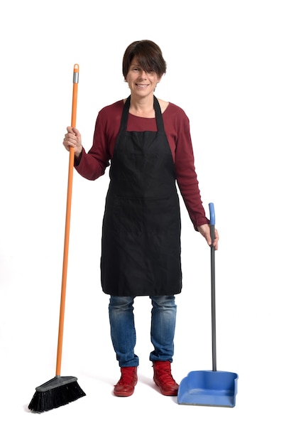 Front view of a housewife with broom on white background