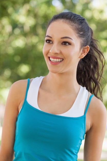 Front view of joyful young woman wearing sportswear