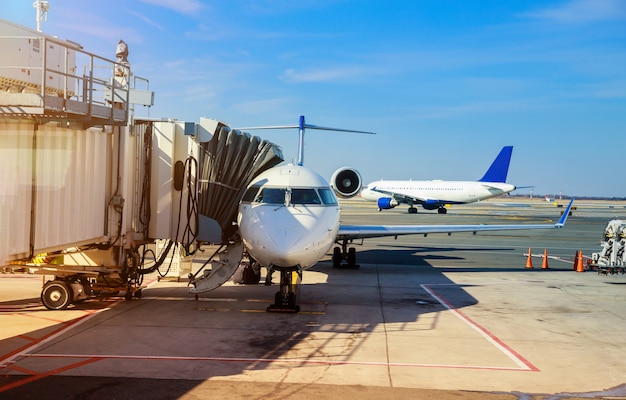 Front view of landed airplane in a terminal of at the John F. Kennedy International Airport