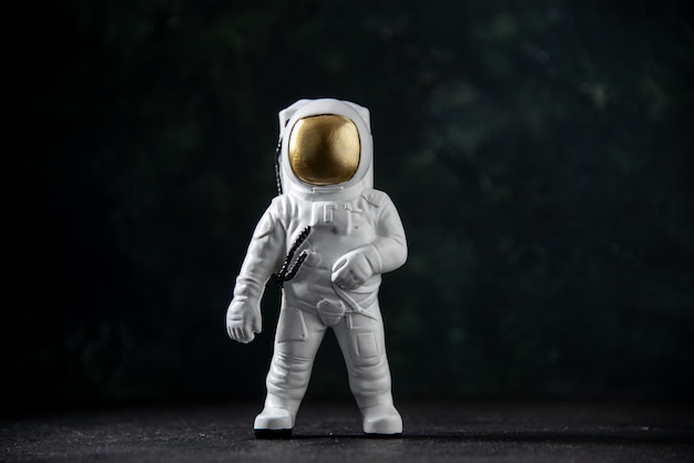 Front view of little spaceman toy on black