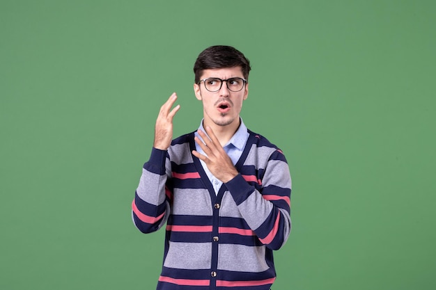 front view male teacher on green background university school student book work lesson woman college colors library