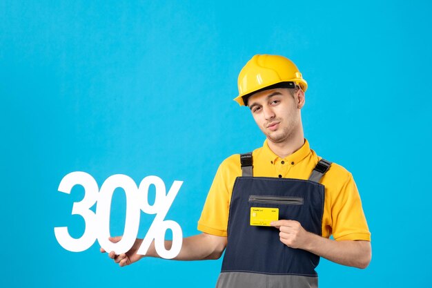 Front view of male worker in uniform with writing and bank card blue 