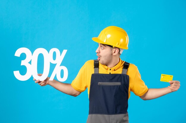 Front view of male worker in uniform with writing and bank card blue 